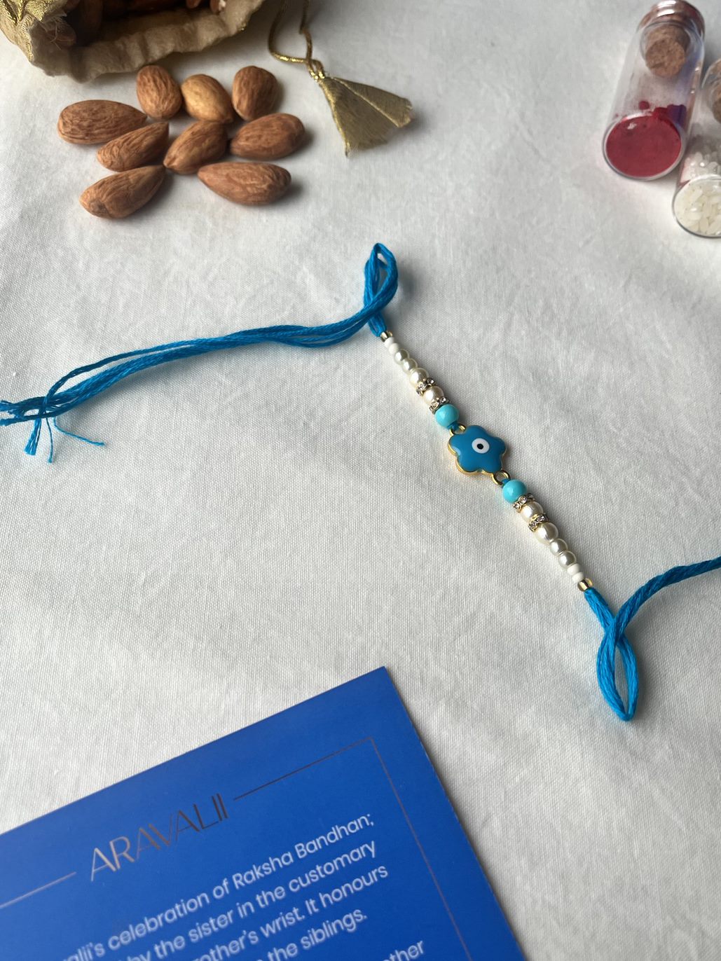 Evil Eye Blue Flower Rakhi + Chocolate